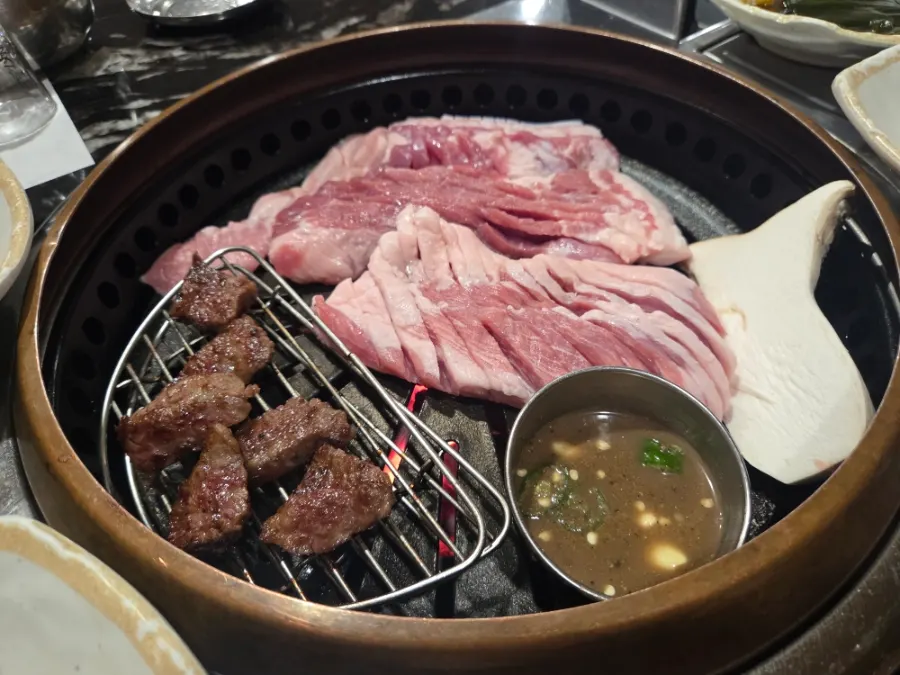 Table at a restaurant selling 1++ hanwoo and Jeju black pork