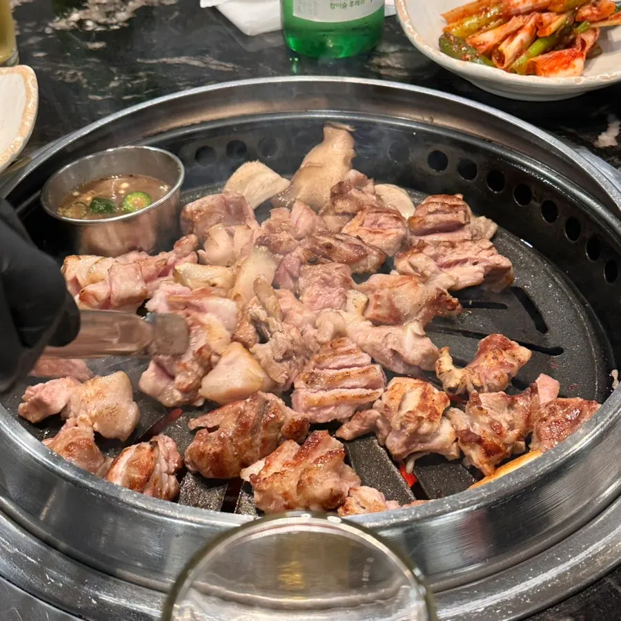 A plate of meat with wasabi and ssamjang on the side