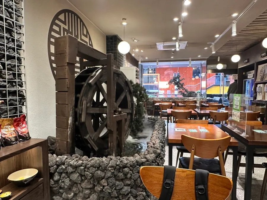 Indoor garden and water wheel inside the restaurant
