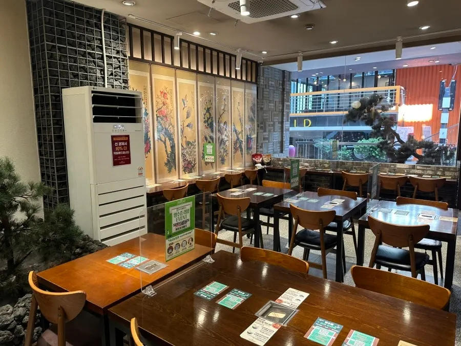 Row of 1-person bar tables inside