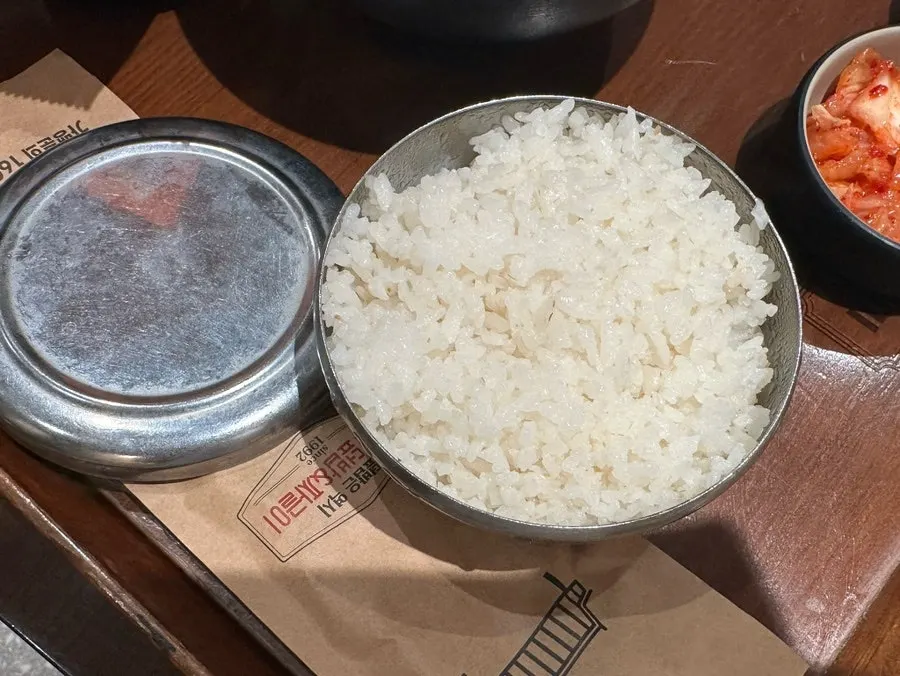 Steamed egg in a stone pot with side dishes