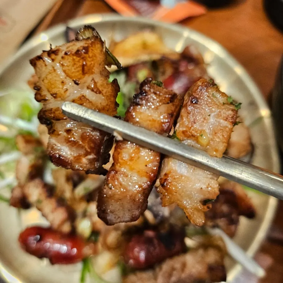 Plate of pork belly stir-fried with green onion