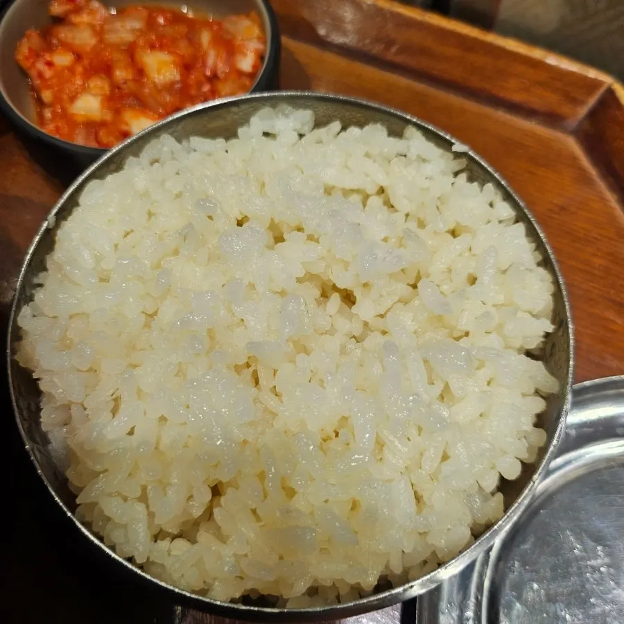 Close-up of kimchi jjigae broth and ingredients