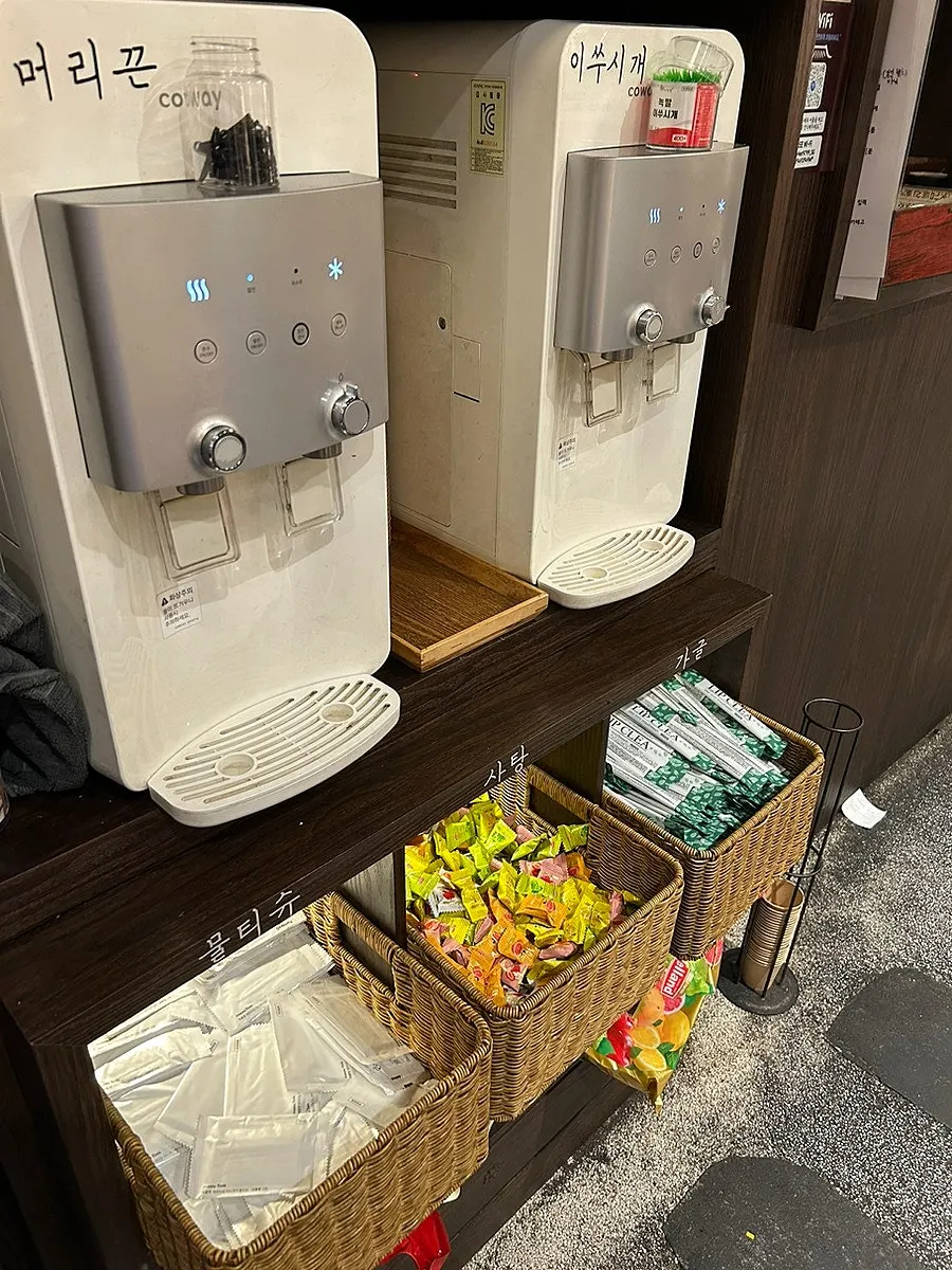 Water and drinks set up at the self-service corner