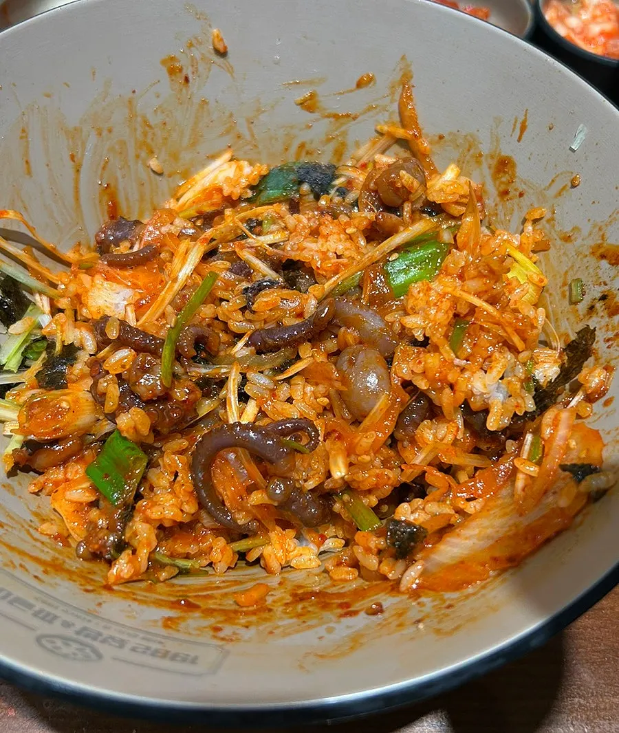 Thick chunks of octopus in the rice bowl before mixing