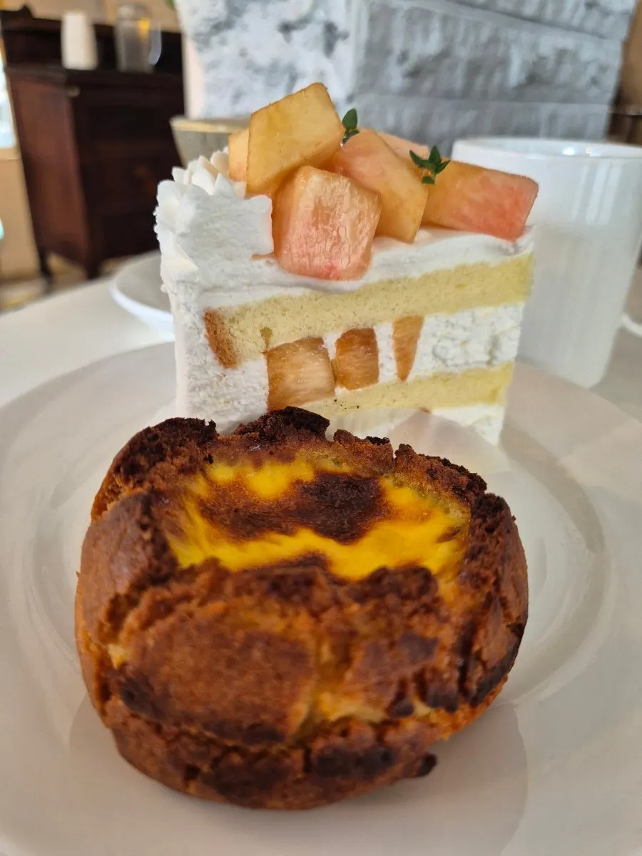 Cross-section of peach cream cake packed with peach pieces