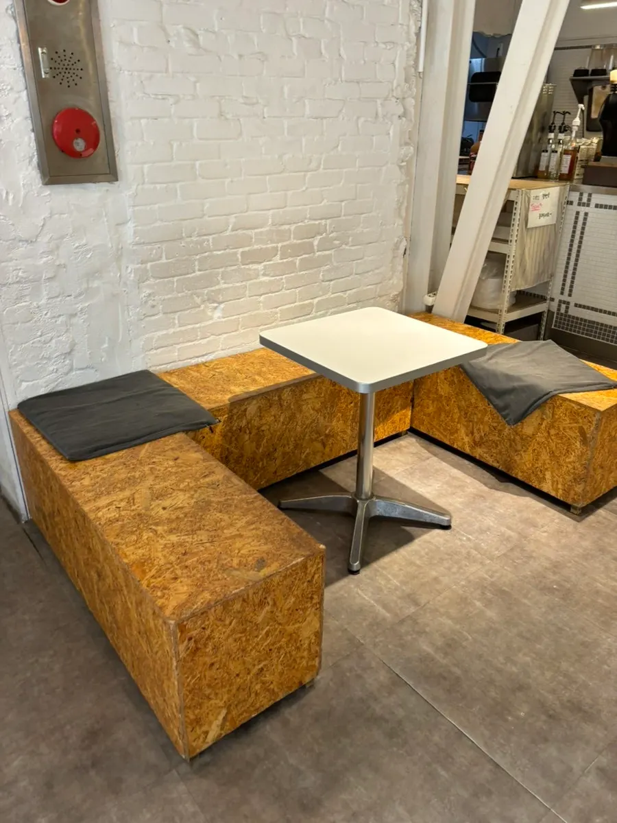 Café tables placed throughout the space
