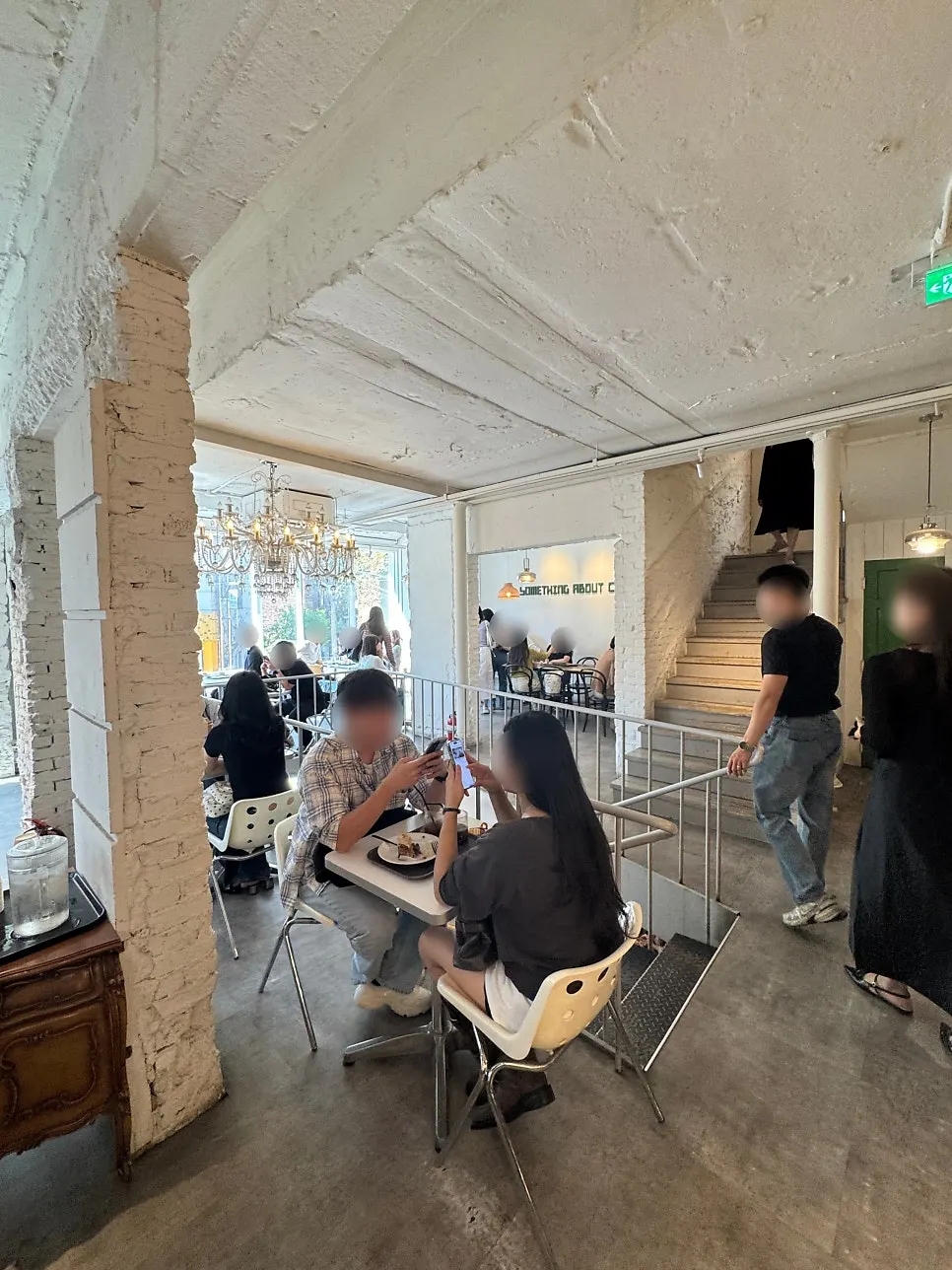 Group table area on the 1st floor of Something About Coffee