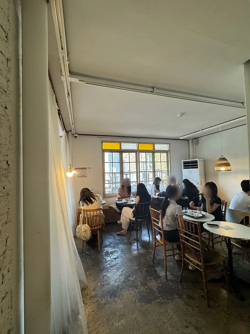 2nd-floor window-wall seating at Something About Coffee