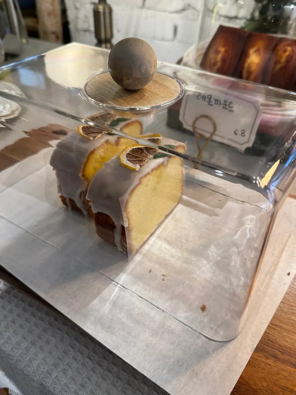 Dessert display case in front of the counter