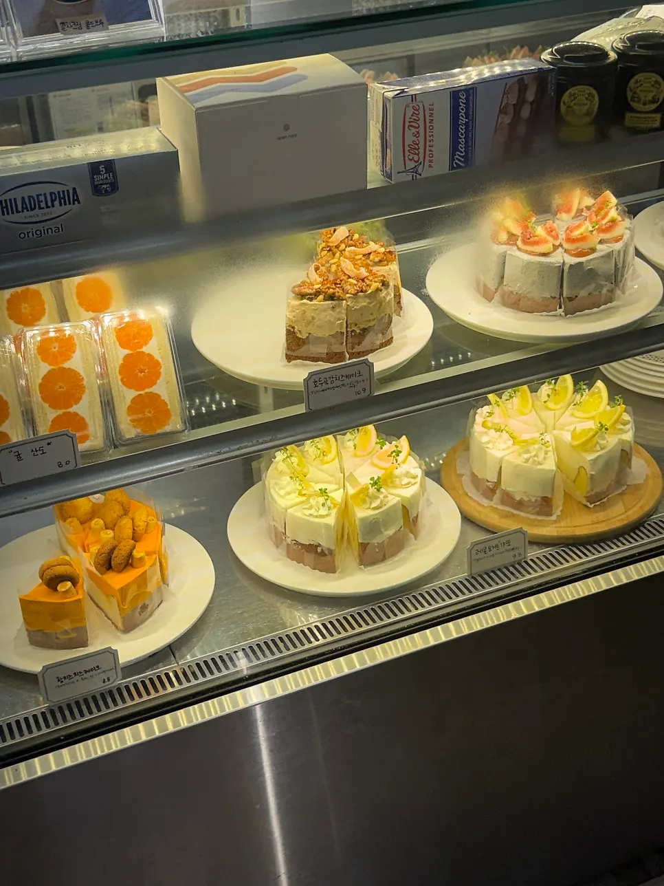 Showcase of fruit-topped cakes