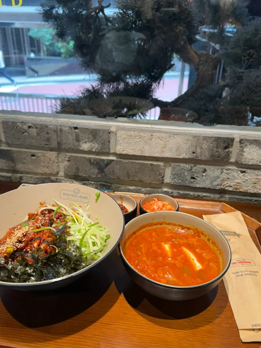 Spicy octopus rice bowl and Jeolla-style beef tartare rice bowl spread