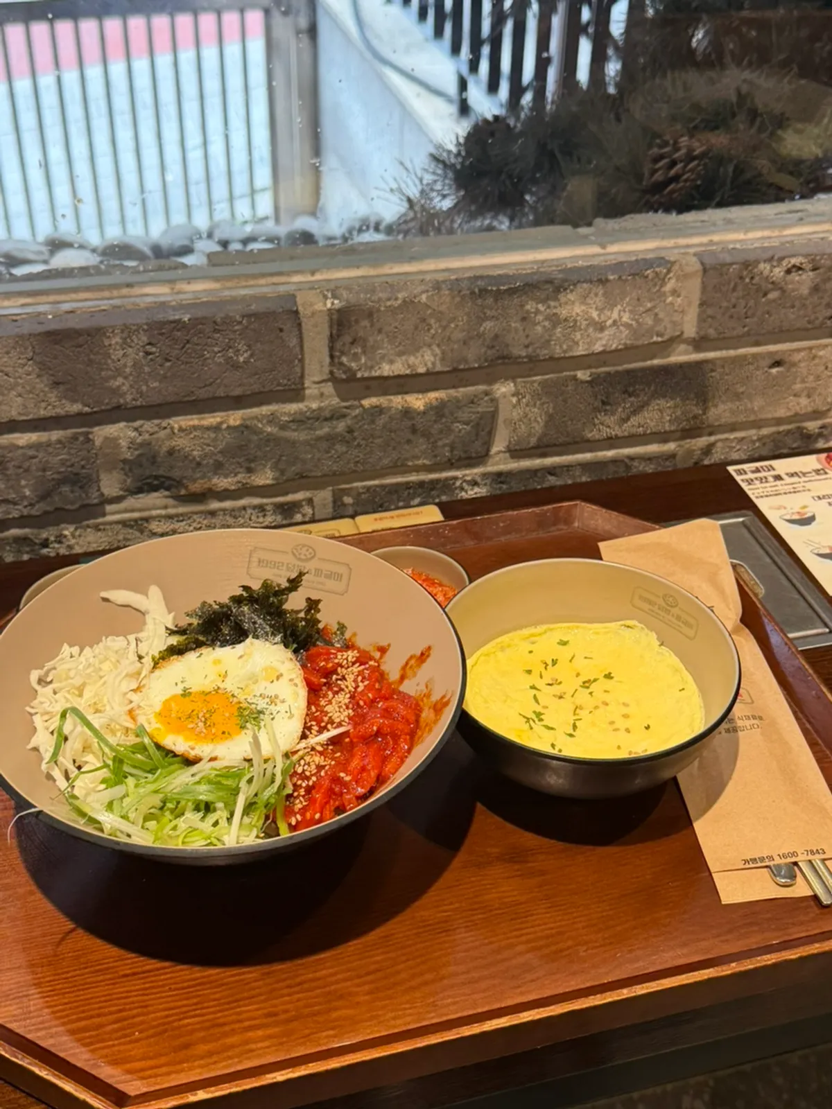 Jeolla-style beef tartare rice bowl topped with shredded green onion