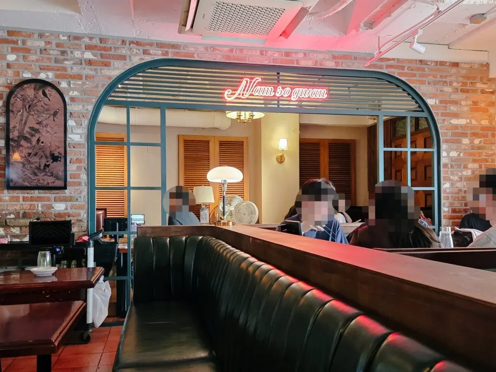 Namsogwan dining seats under Chinese character signage