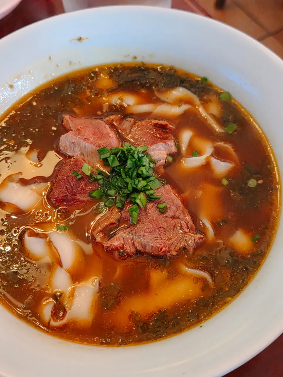 Close-up of the Korean beef bone broth of u yuk dosakmyeon
