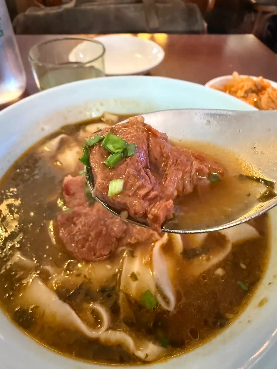 Close-up of the rich beef noodle broth