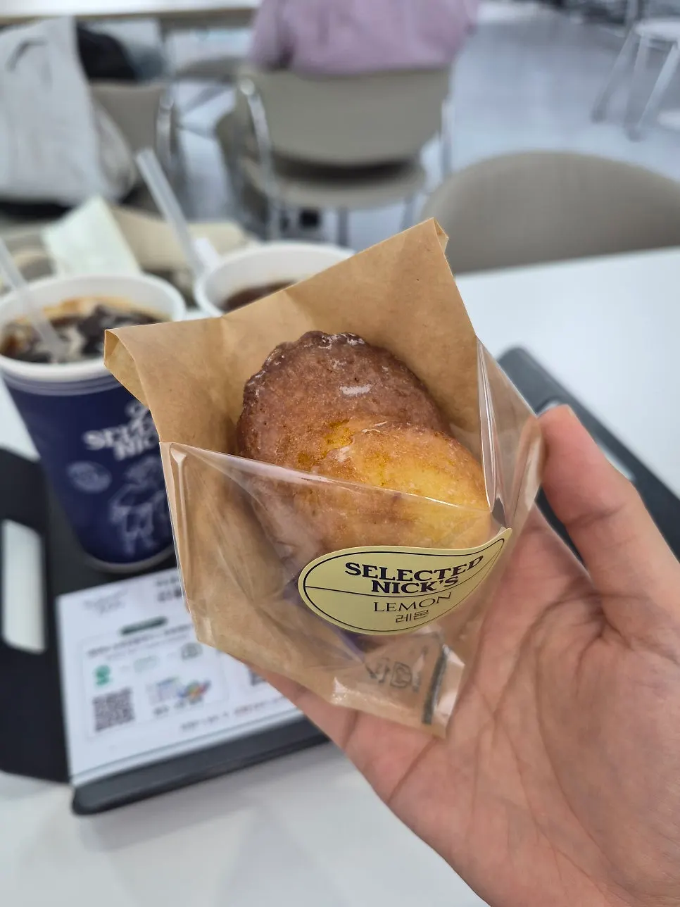 Lemon financier served alongside coffee