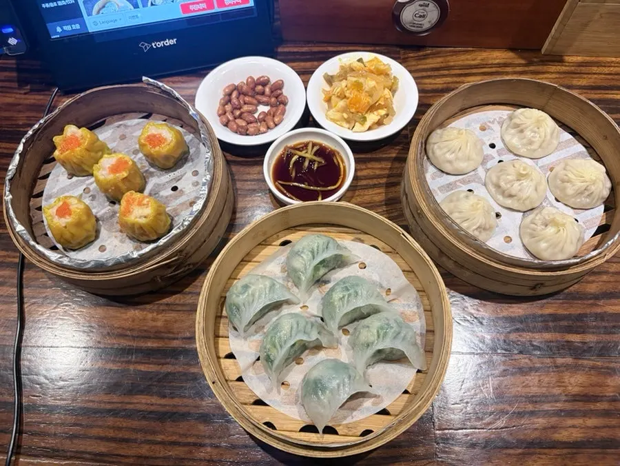 An order of crystal dumplings, xiaolongbao, and siu mai
