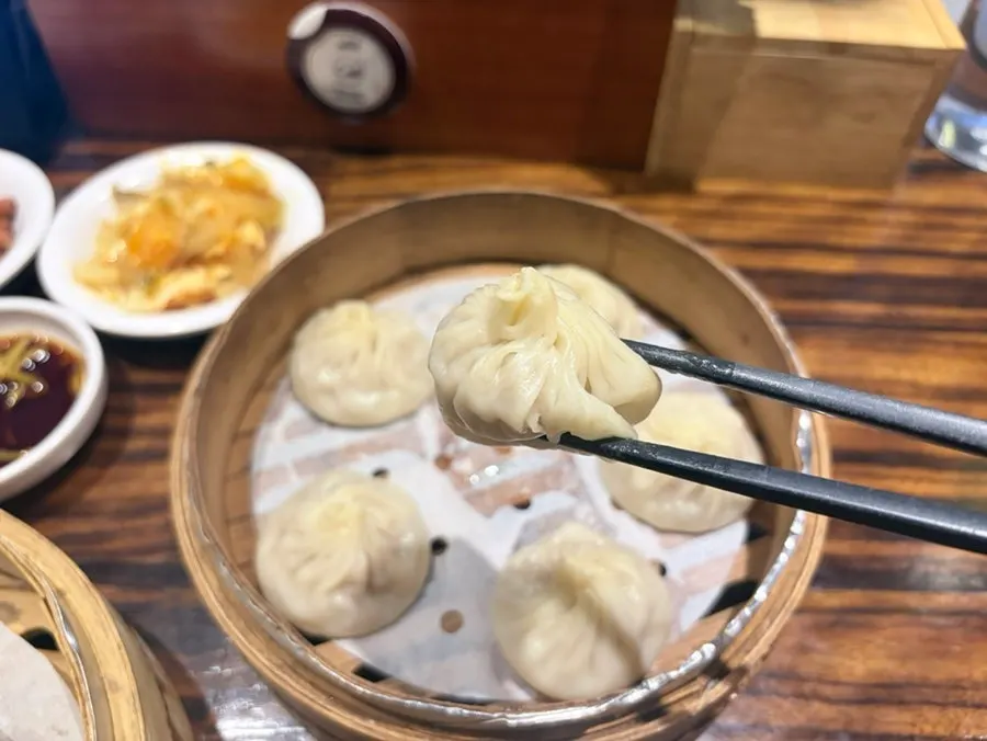 Xiaolongbao with juices flowing out