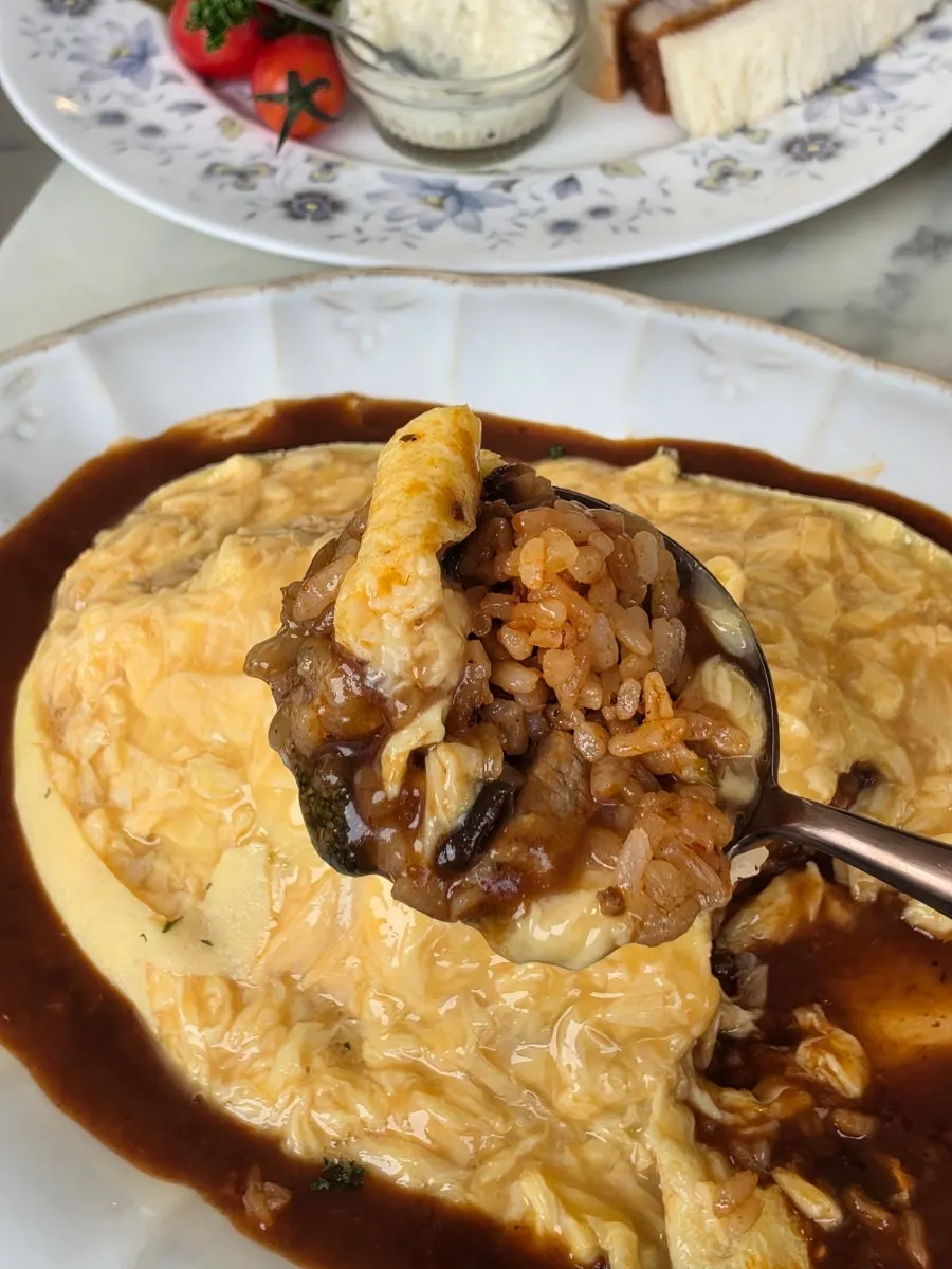 Darak Omelet Rice generously drizzled with sauce