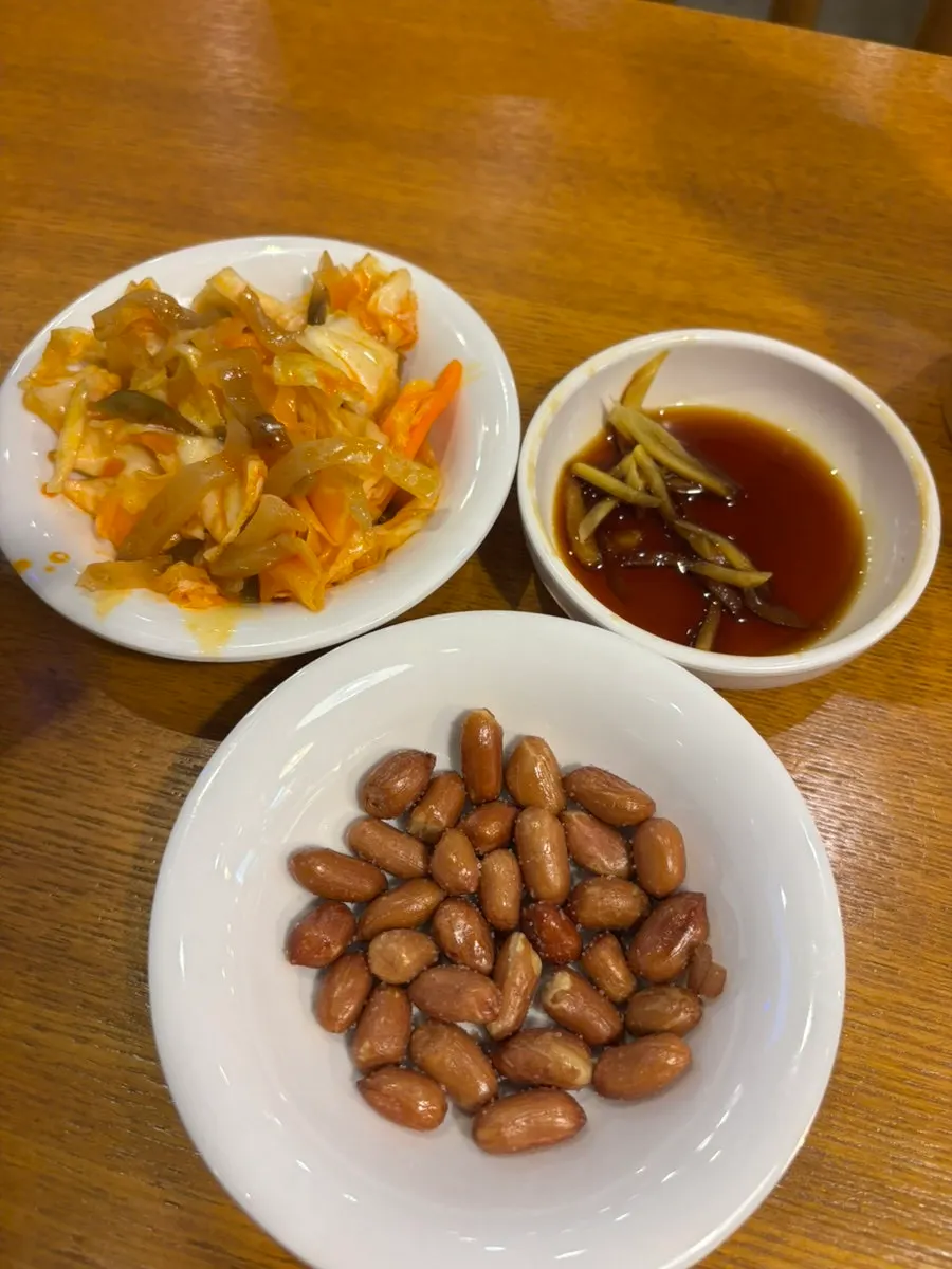 Sinbok Myeongwan xiaolongbao on a spoon