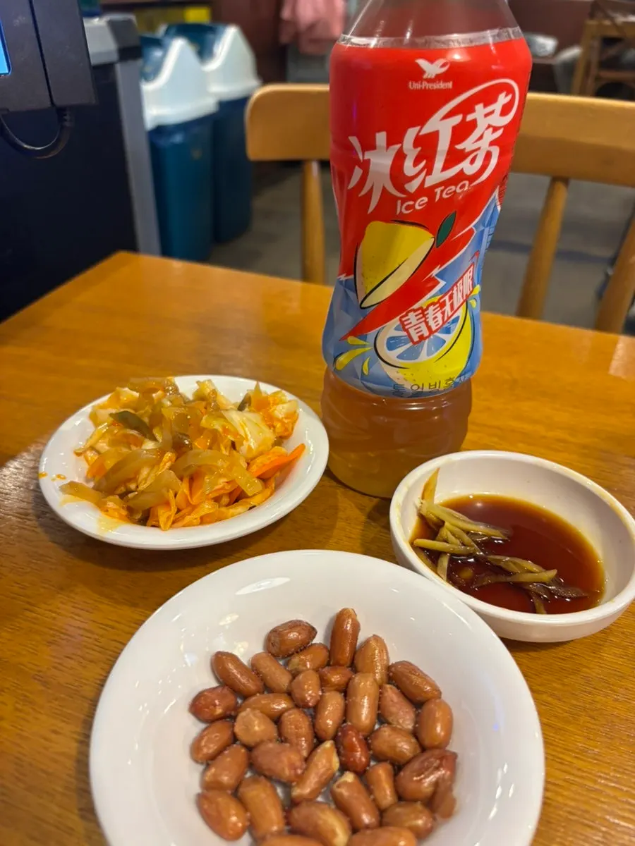 Broth spilling from a torn xiaolongbao wrapper