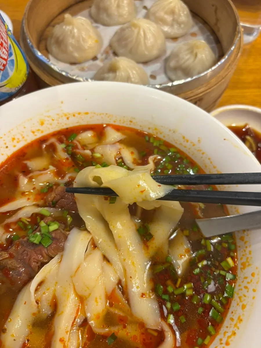 Bowl of dao xiao mian with rich broth