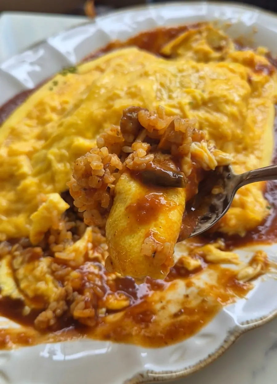 Omelet rice egg unfolding softly