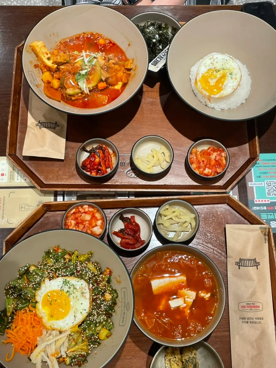 Table set with deumppuk jjageuli and bibimbap