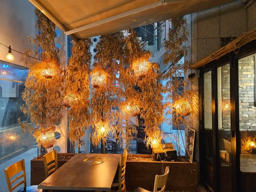 Full view of the restaurant entrance with lights on