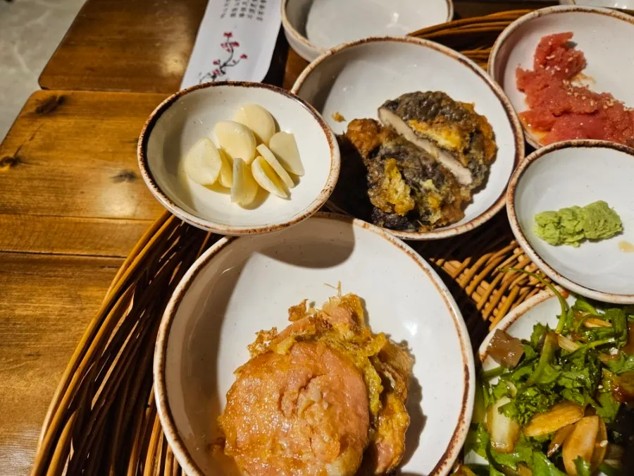 Lettuce wraps and salted pollock roe among other side dishes