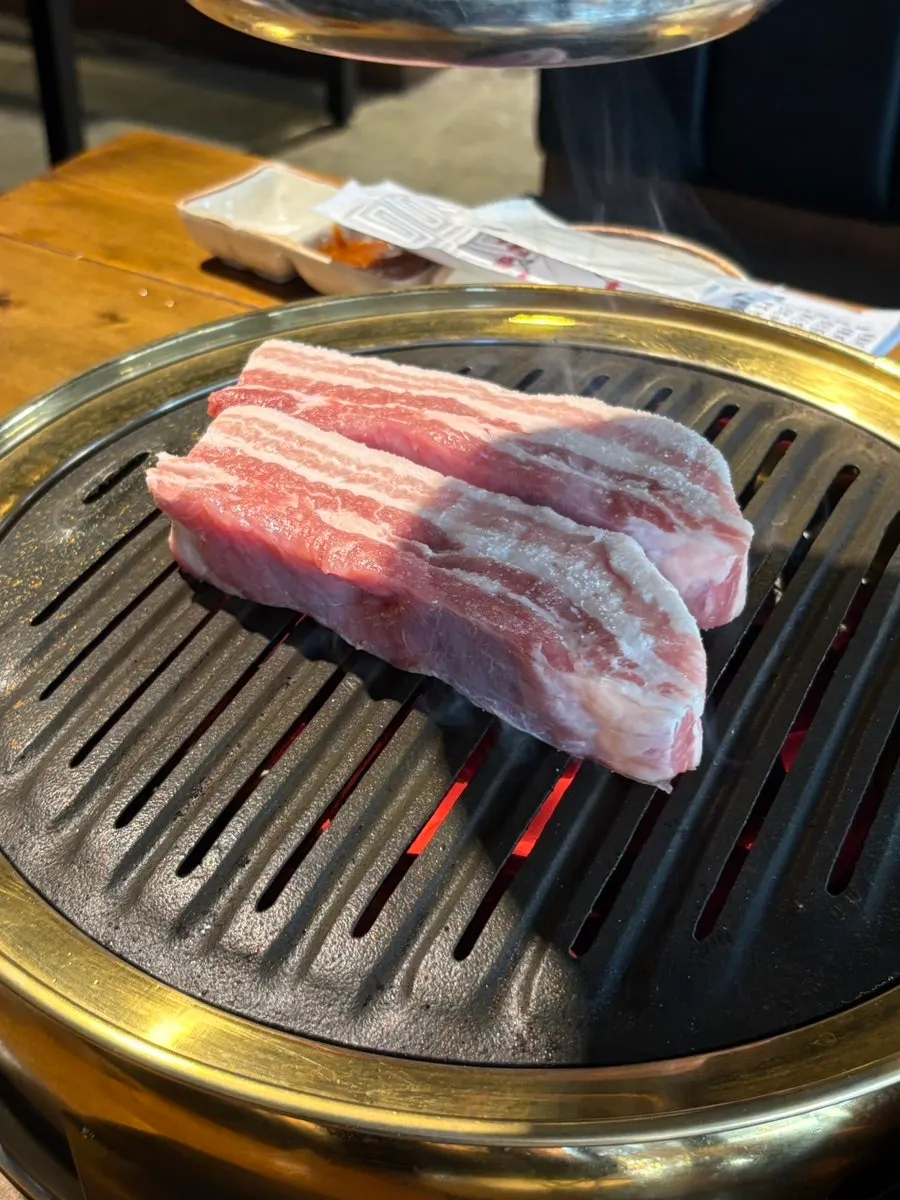 A plate of thickly sliced aged pork belly