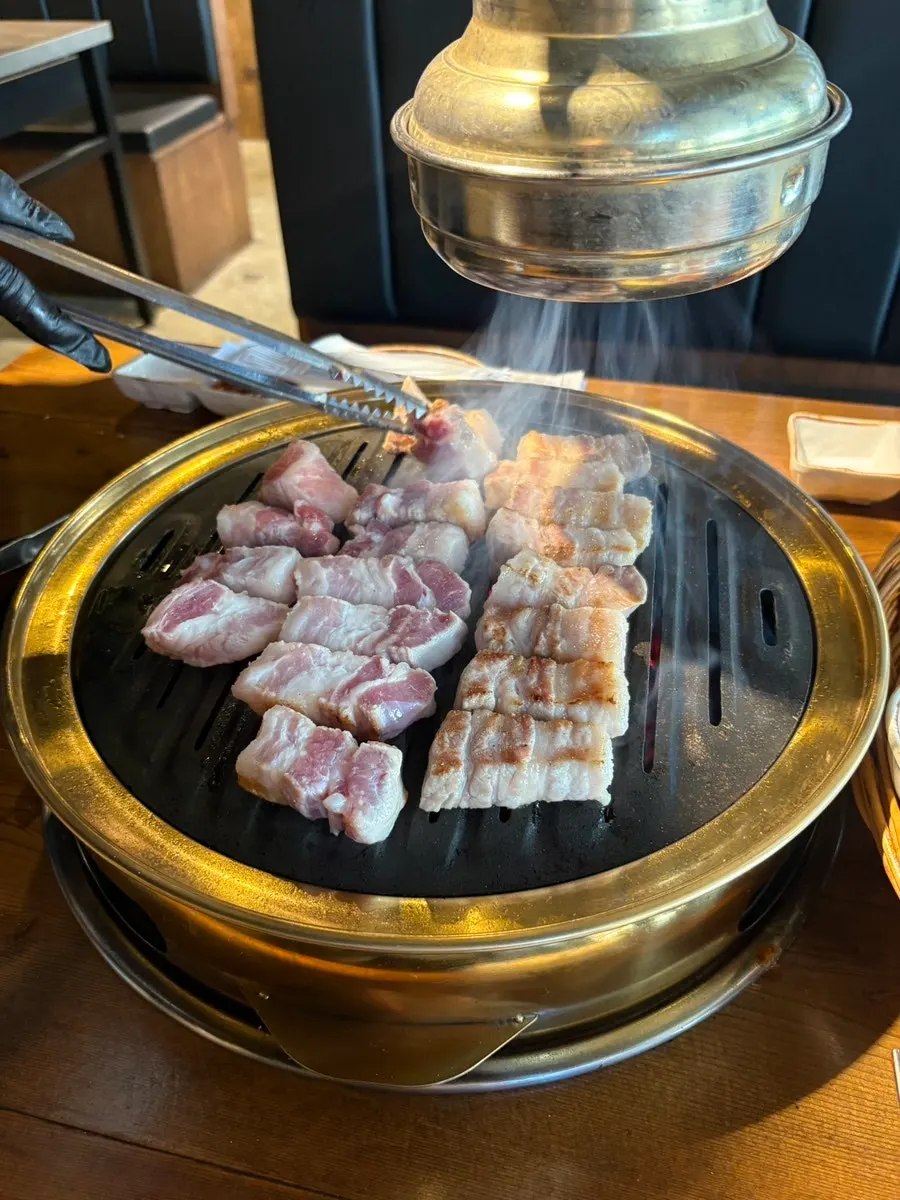 Aged pork belly grilling on the pan