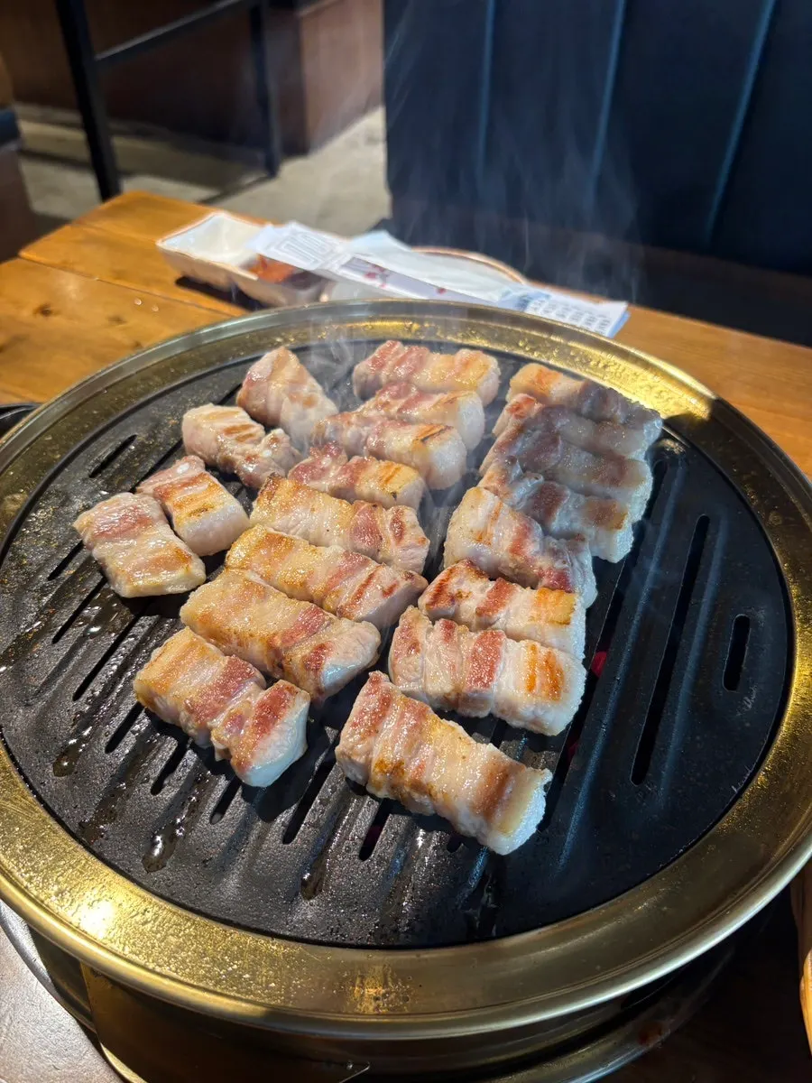 Close-up of golden-brown grilled pork belly