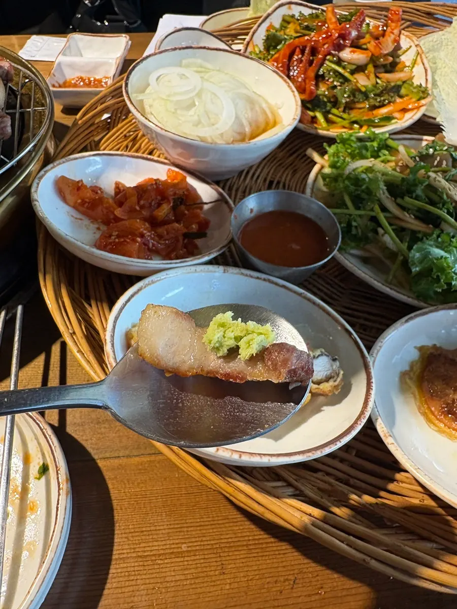 Meat wrap with kimchi, oysters, and napa cabbage