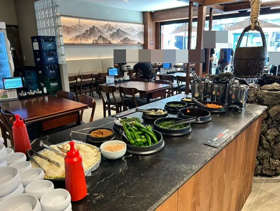 Complimentary heotgae tea and basic side dishes