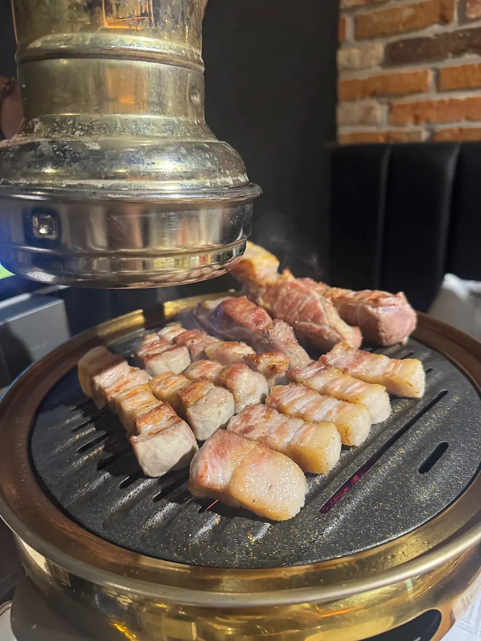 A piece of meat grilled by the staff