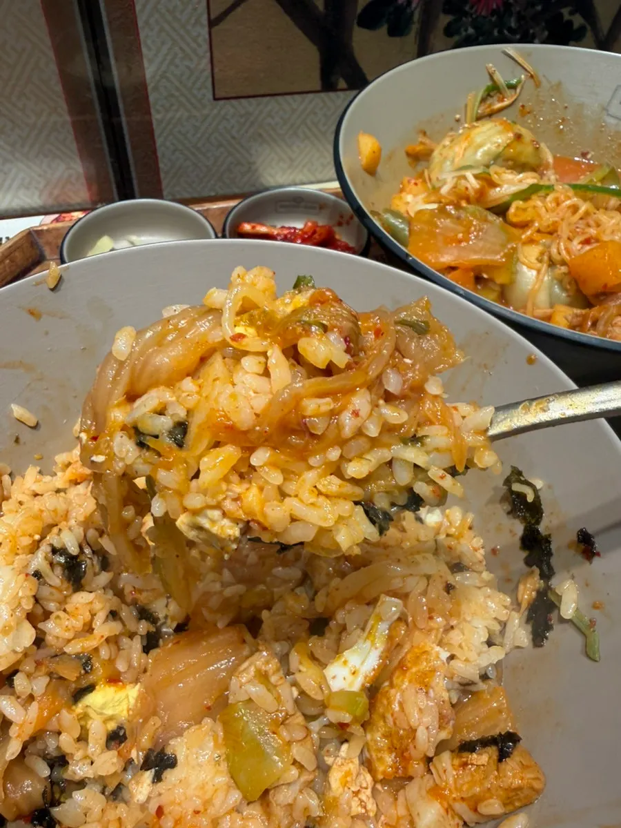Egg-topped rice mixed with seaweed flakes and sesame oil