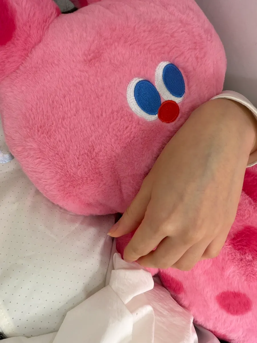 Large stuffed animal held during the treatment