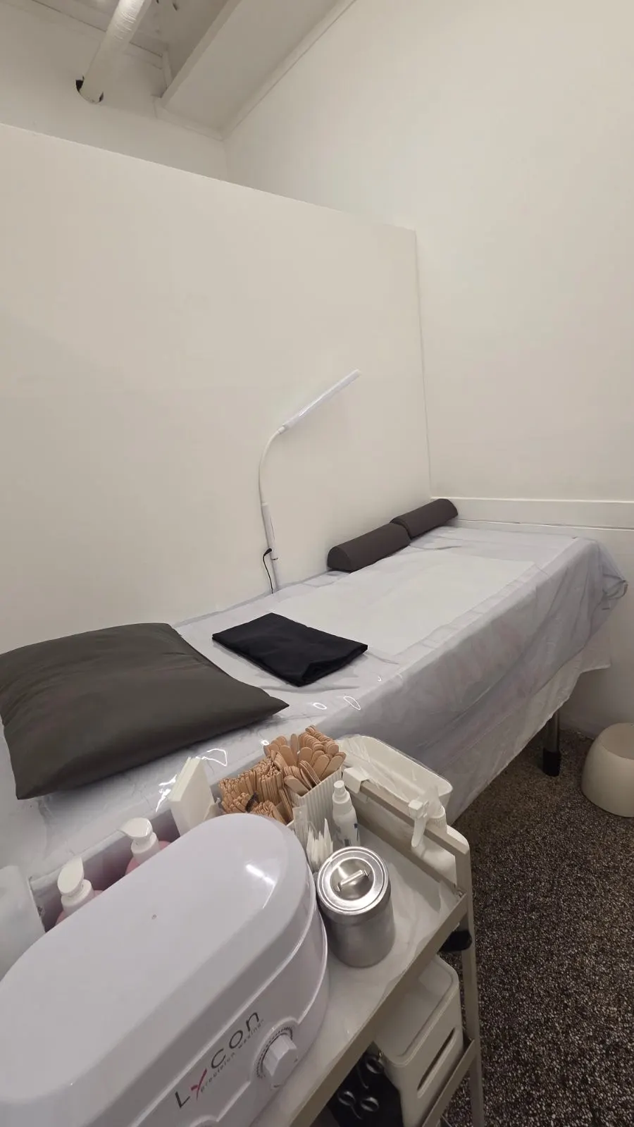 Disposable hygiene items and calming spray arranged on a tray