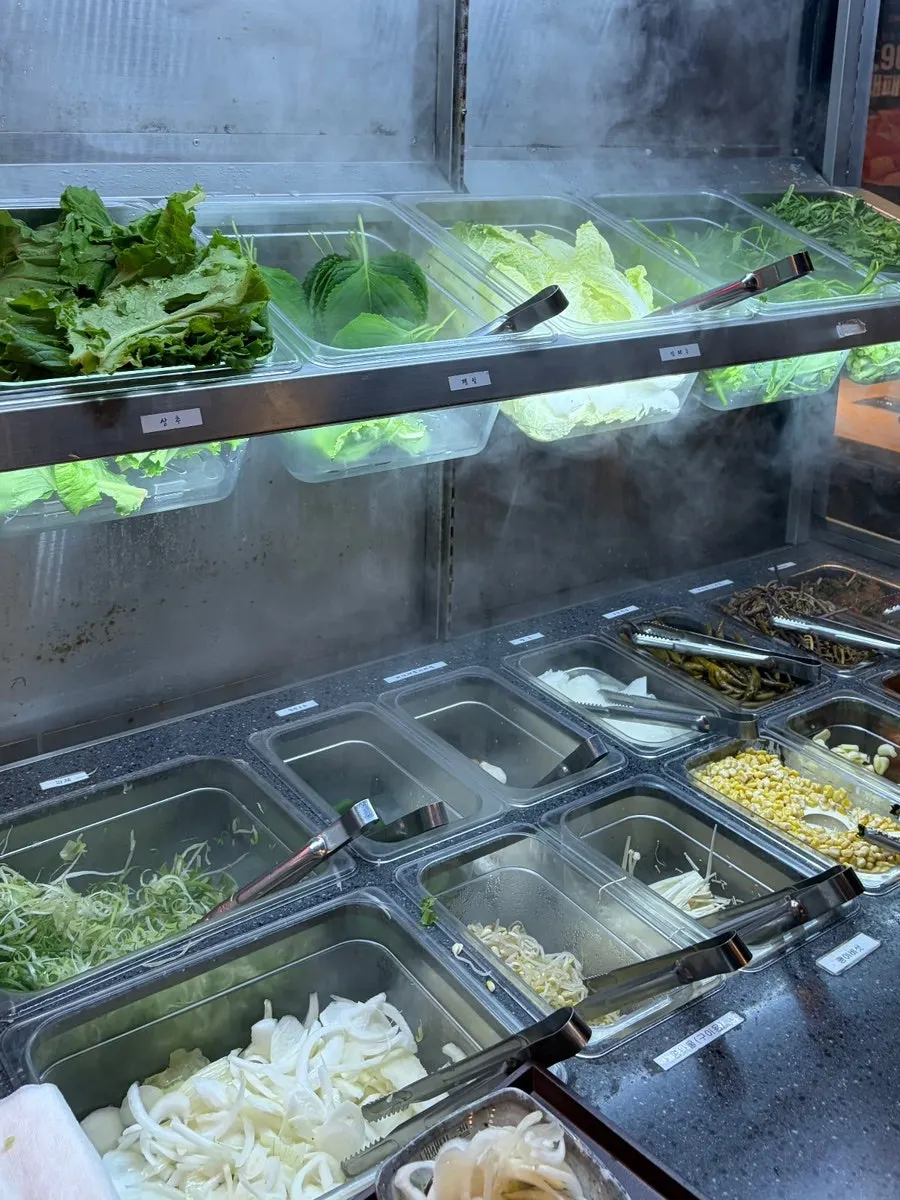 Vegetables and side dishes at the Daepae Market self-serve bar