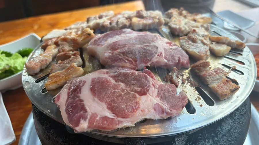 Grilled meat infused with charcoal aroma