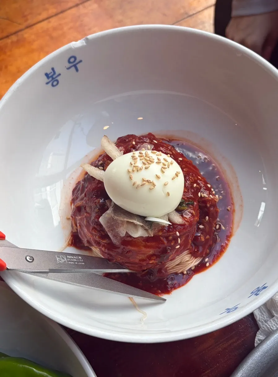 Bibim naengmyeon shared with grilled meat