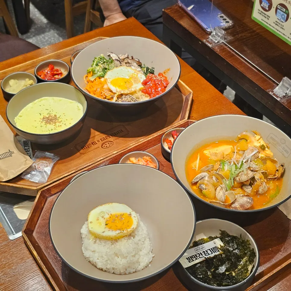 Table set of seasoned beef tartare Jeonju bibimbap and clam doenjang jjageuli
