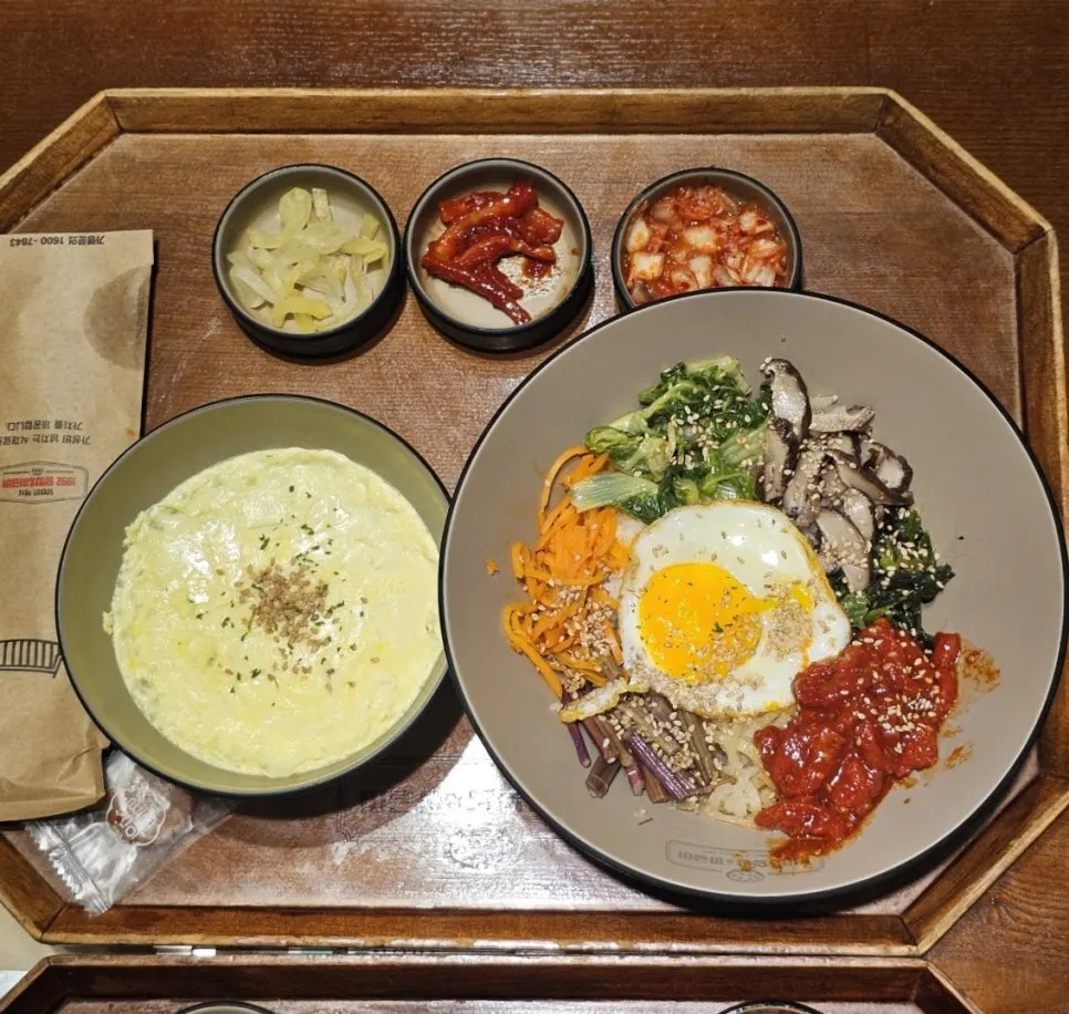 Bibimbap tray with three side dishes and steamed egg