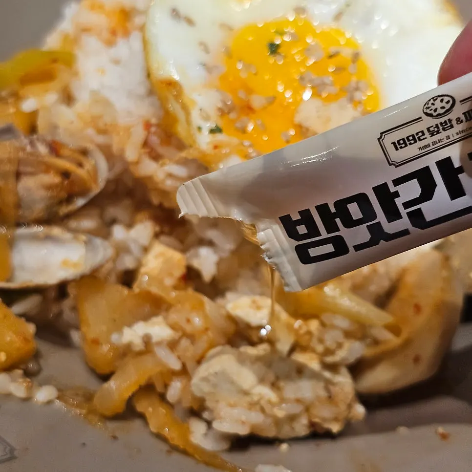 Rice topped with jjageuli broth and ingredients