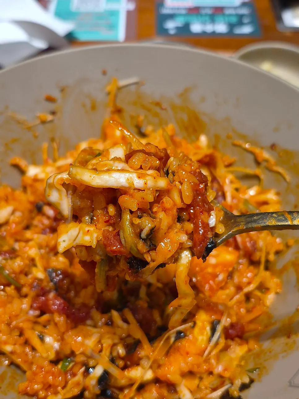 A spoonful of the mixed spicy yukhoe rice bowl