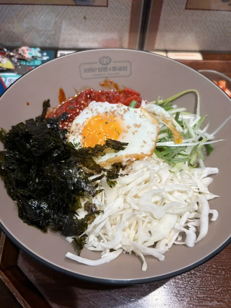 Yukhoe rice bowl topped generously with raw beef