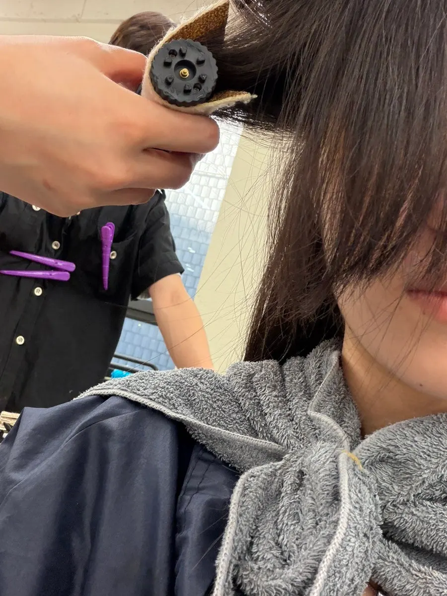 Checking hair condition during the perm treatment