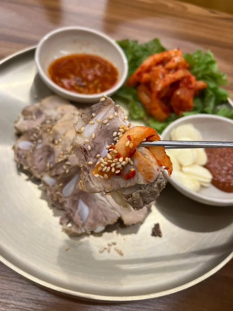 Bossam meat topped with mumallaengi
